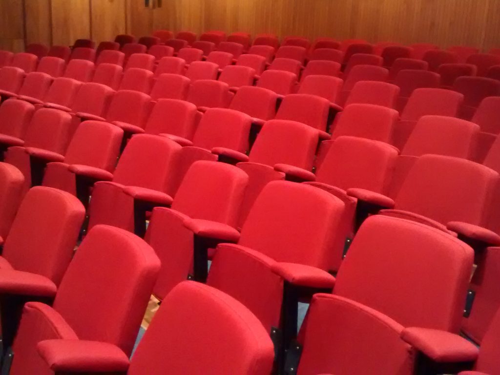 theatre seat reupholstery for Natural History Museum upholstered using fabric from Camira Hill Upholstery & Design Essex and London